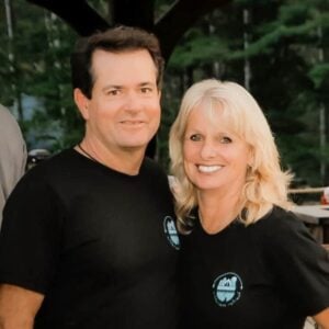 A man and woman in black shirts posing for a picture during the MC Fireside Chats on December 14th.