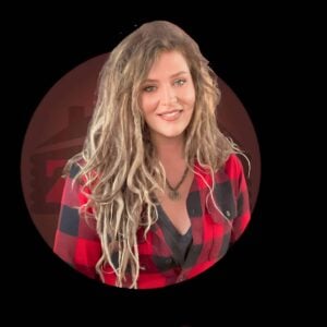 On October 4th, 2023, during the MC Fireside Chats event, a woman in a red and black plaid shirt is smiling.