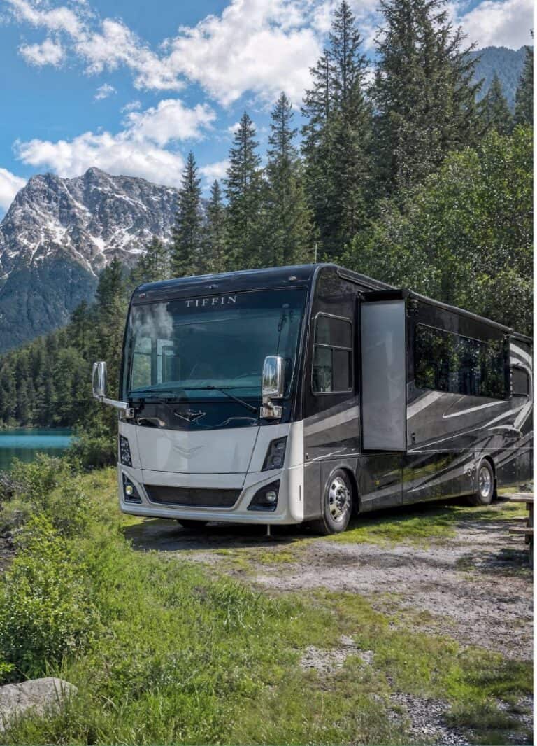 Motorhome parked beside a mountain lake